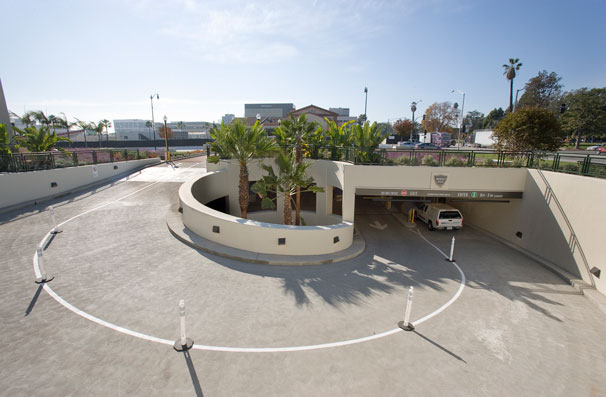 The ramp spirals down into the garage, quickly moving vehicles out of sight.