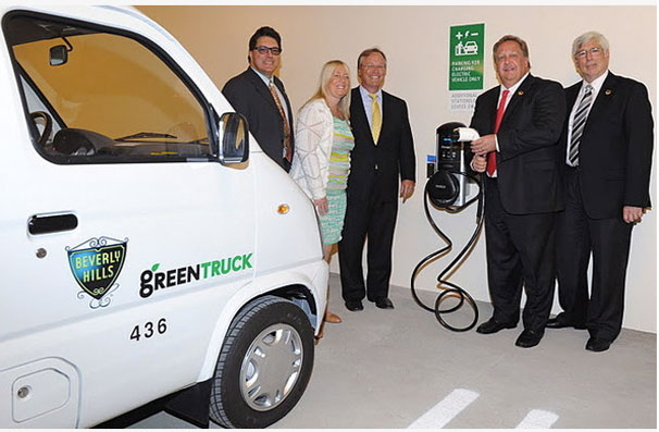 The Crescent Drive Garage is the first city-owned parking facility with electric vehicle power stations on each floor--as demonstrated here by Mayor , himself.