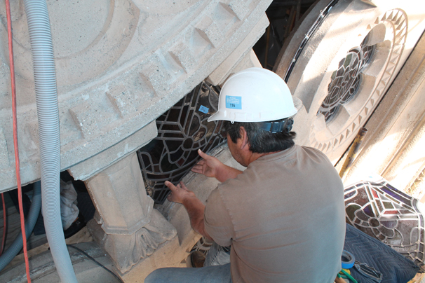 Judson Studios re-installs the restored stained glass panels