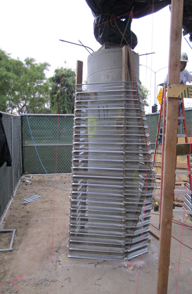 Butch then surrounded the wrapped pillars with a framework of rebar and chicken wire. The shotcrete applied by filled 