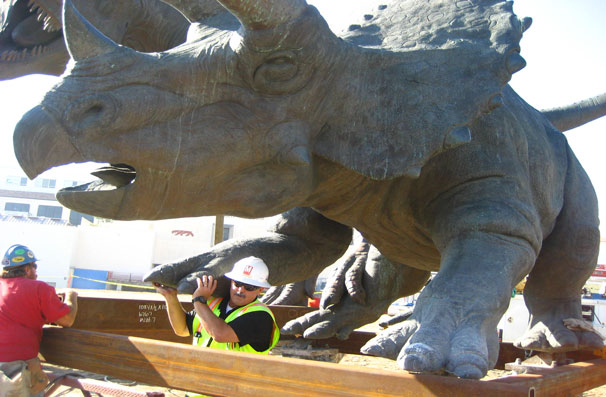 Don't know my own strength! Triceratops gets caged with a little help from a friend.