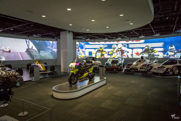 An immersive multimedia display creates the backdrop for the Motorsports Gallery