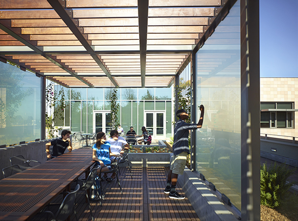 A rooftop deck offers glass dry-erase surfaces for outdoor learning opportunities